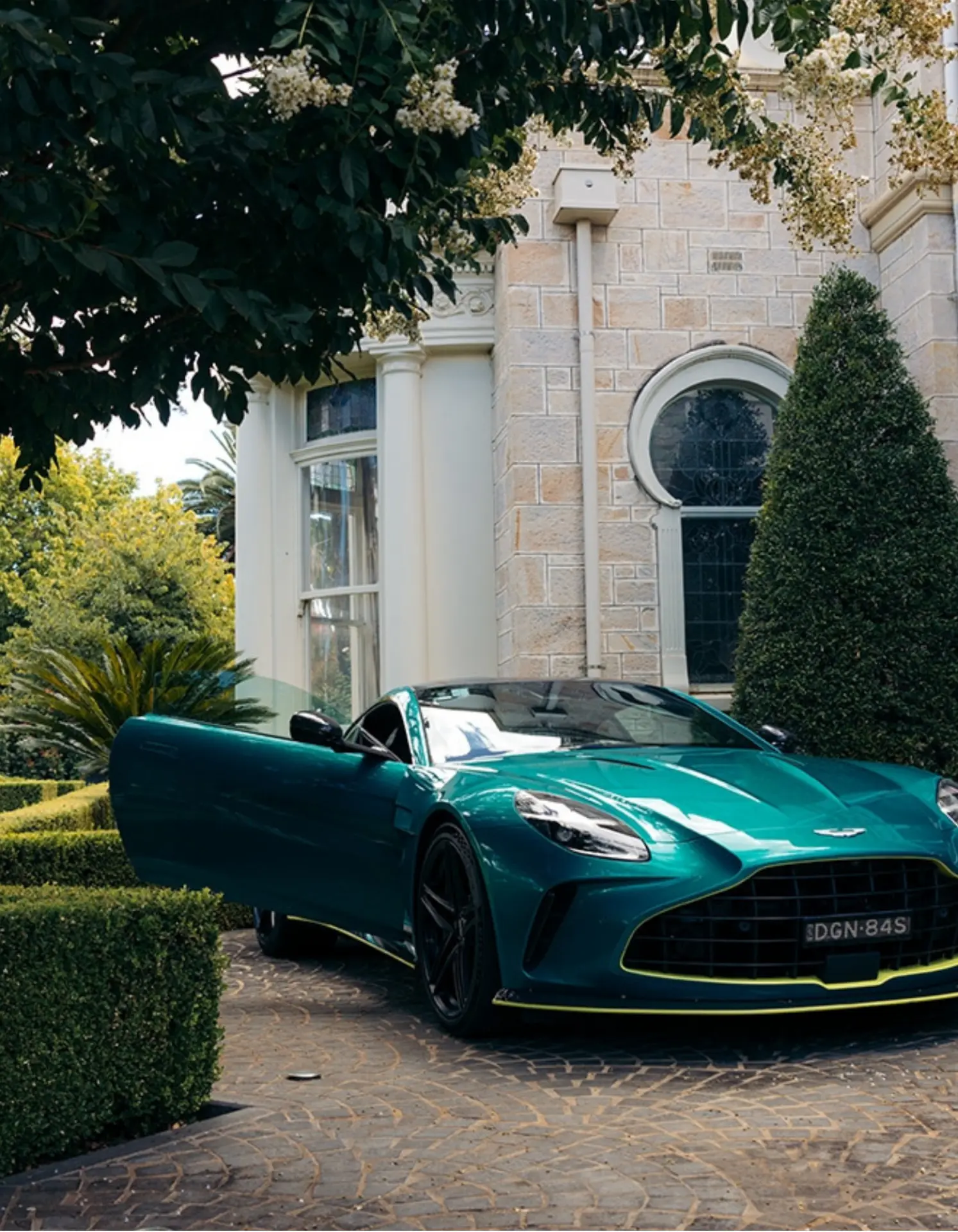 Aston Martin parked at a luxury private estate during a premium golf event in Adelaide