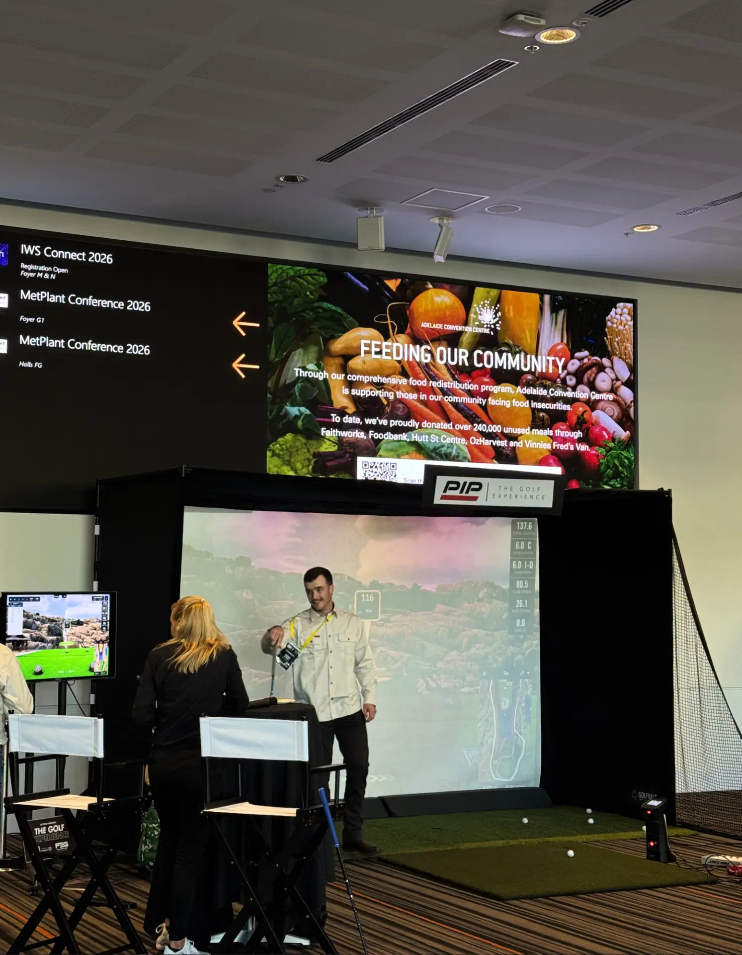 Golf simulator hire at the Adelaide Convention Centre with conference delegates playing a closest-to-the-pin challenge
