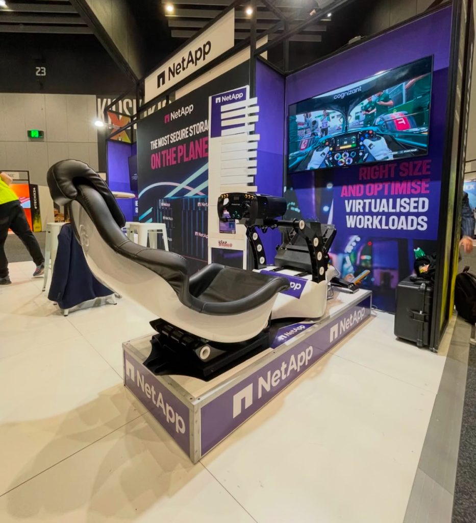 NetApp branded racing simulator on an exhibition stand at an Adelaide trade show