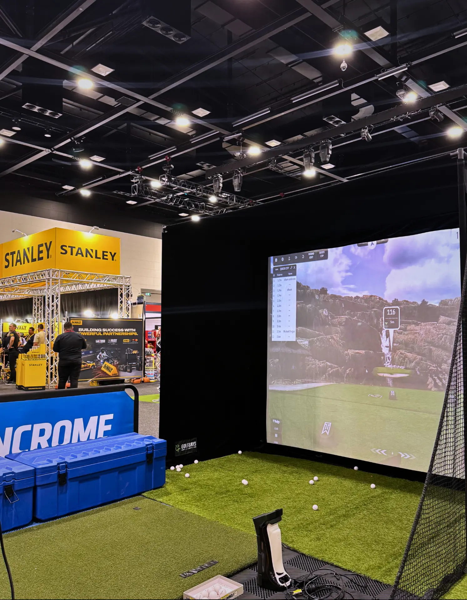 Kincrome expo golf simulator activation with a full-size hitting bay and launch monitor at an Adelaide trade show