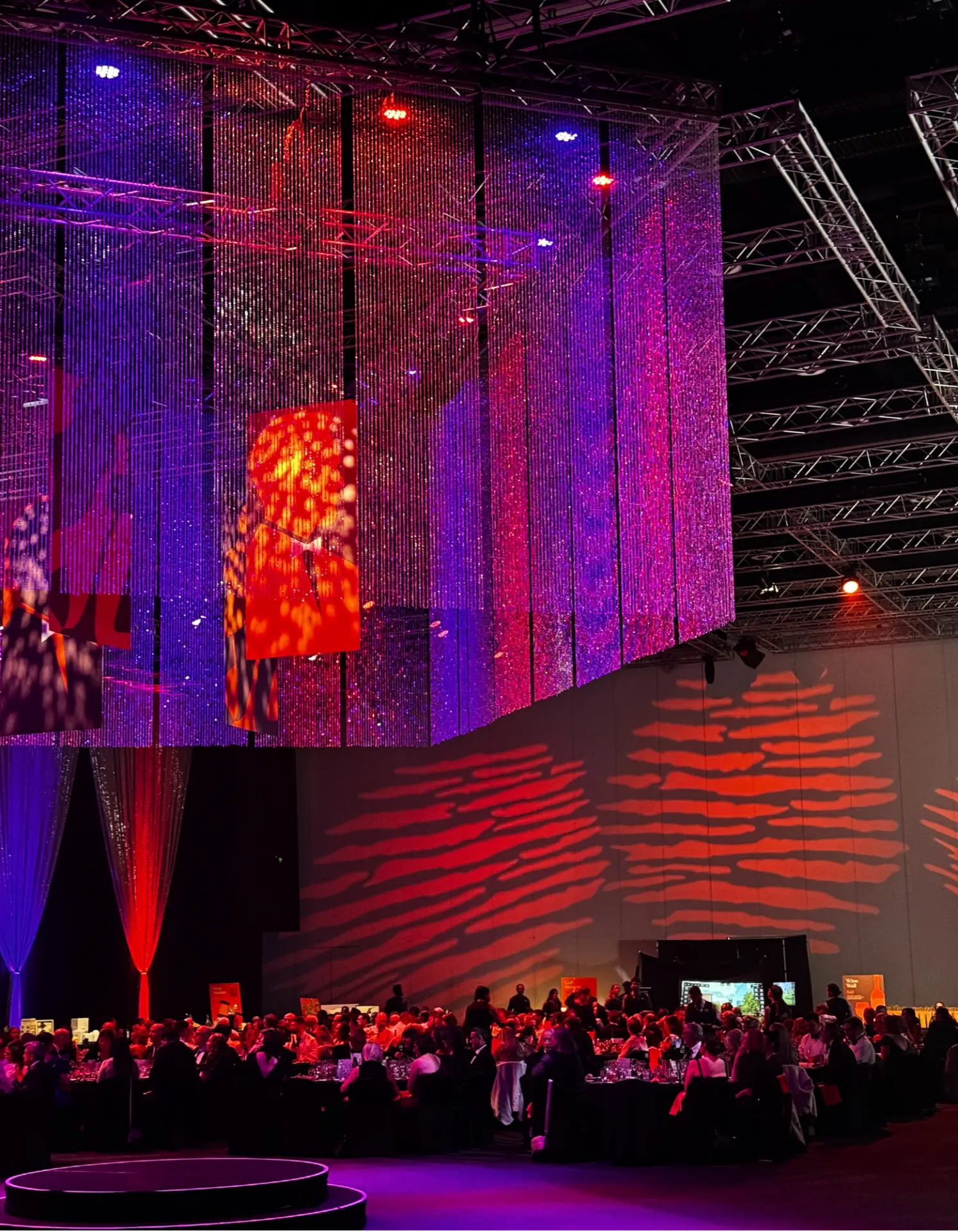 Corporate gala dinner with crystal LED curtains and dramatic lighting at an Adelaide event venue